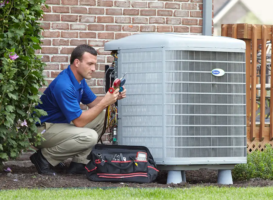 HVAC technician inspecting an outdoor AC unit in Burlingame