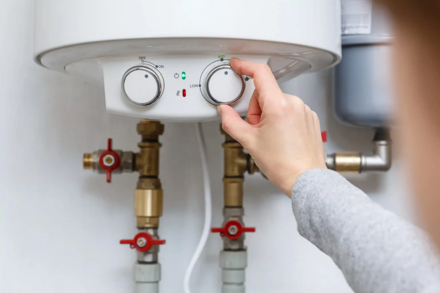Technician adjusting a water heater in Burlingame